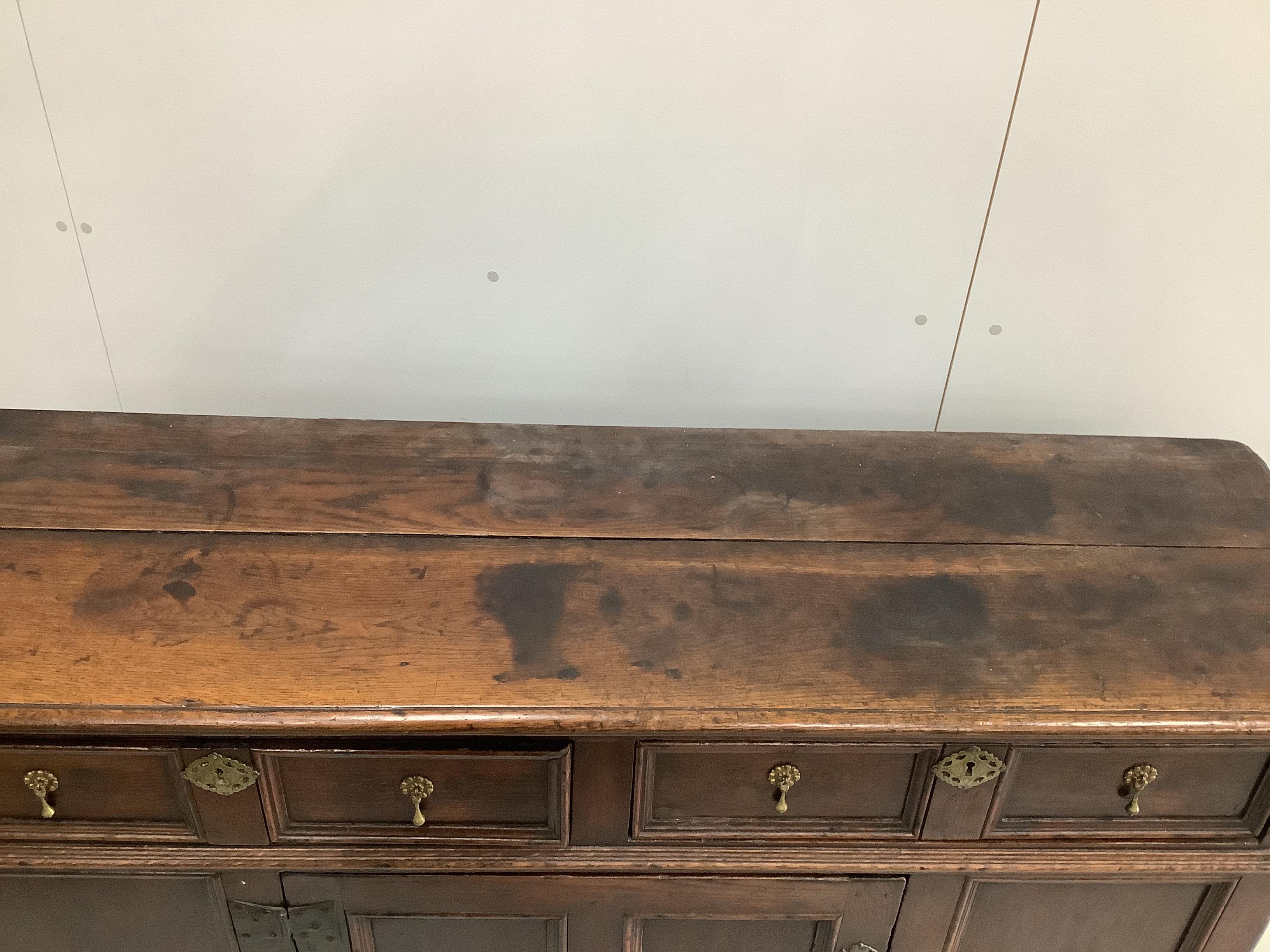 A small 18th century oak low dresser, width 152cm, depth 46cm, height 87cm